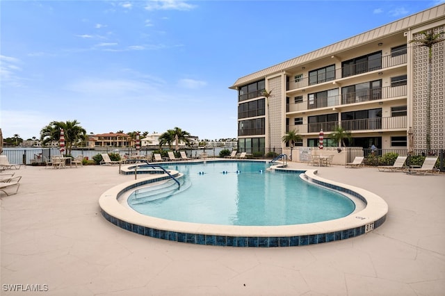 view of swimming pool featuring a patio area