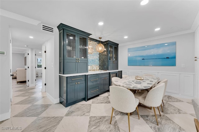 dining room featuring crown molding