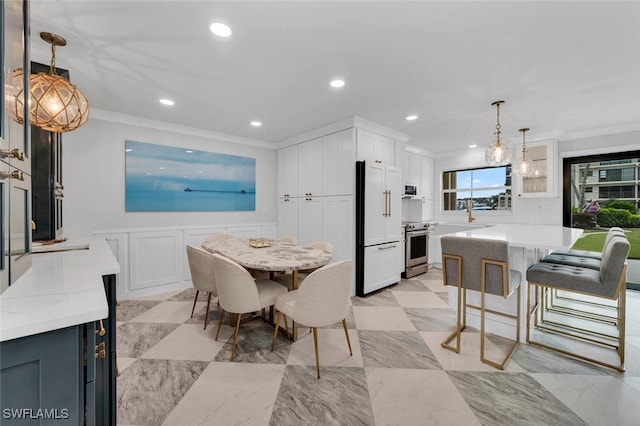 dining room featuring crown molding