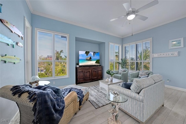 living room with ceiling fan, ornamental molding, and light hardwood / wood-style floors