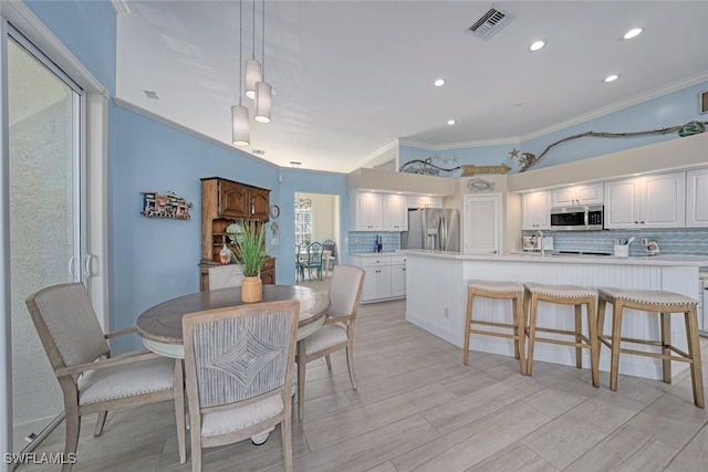 dining area featuring ornamental molding