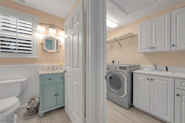 laundry room featuring electric dryer hookup and sink