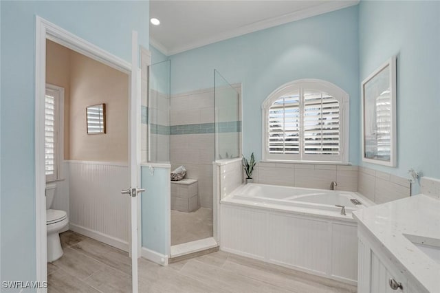 full bathroom featuring vanity, ornamental molding, plus walk in shower, and toilet