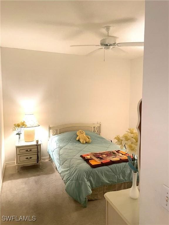 bedroom with ceiling fan and carpet flooring