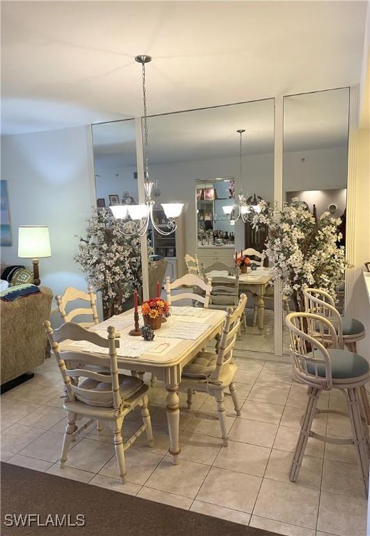 dining space featuring light tile patterned floors