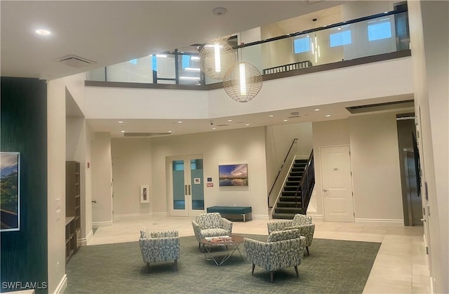 lobby with visible vents and stairs