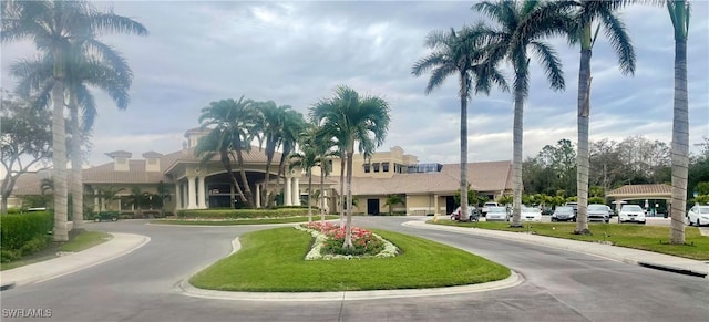 view of property featuring curved driveway