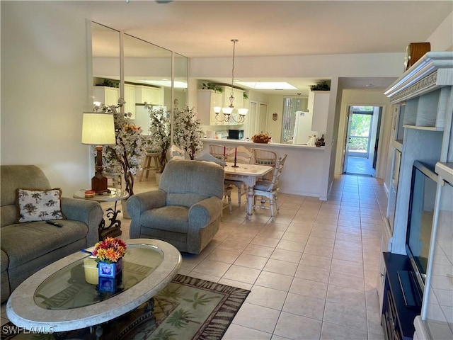 living room with an inviting chandelier and light tile patterned flooring