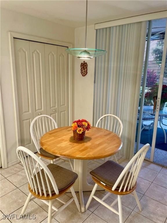 dining space with light tile patterned flooring