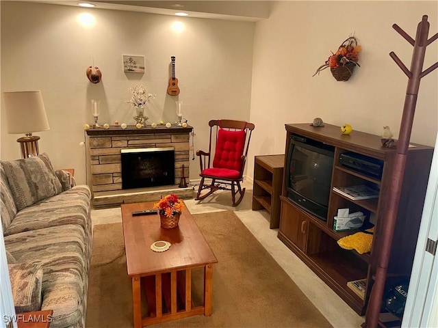 carpeted living area with a fireplace