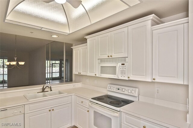 8580 Cedar Hammock Cir Unit 714, Naples, FL 34112 - kitchen featuring white appliances, light countertops, white cabinetry, and recessed lighting