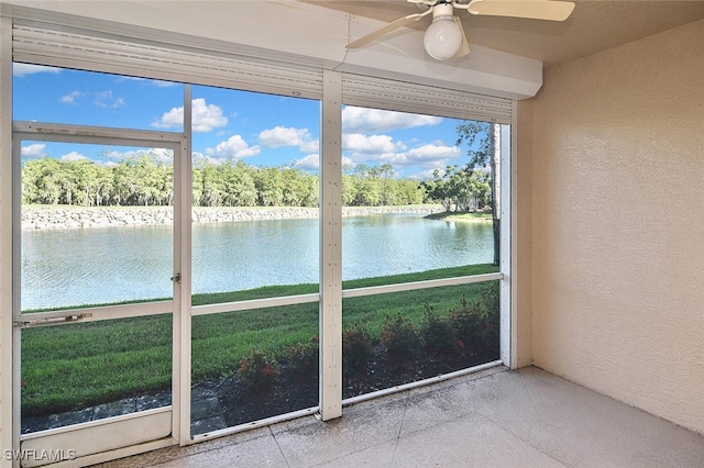 8580 Cedar Hammock Cir Unit 714, Naples, FL 34112 - unfurnished sunroom featuring a water view and a ceiling fan