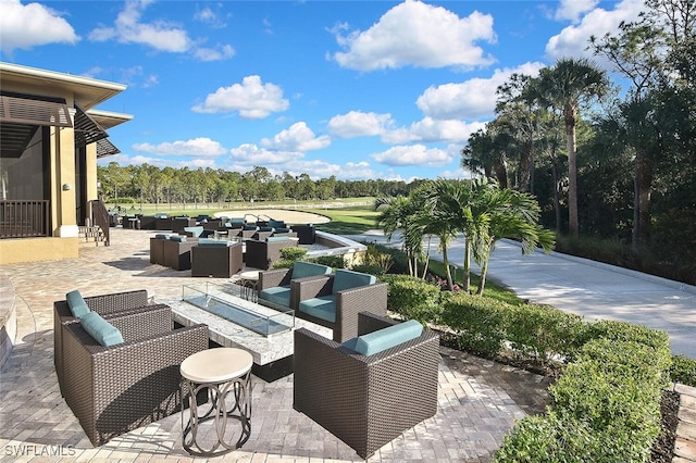 8580 Cedar Hammock Cir Unit 714, Naples, FL 34112 - view of patio / terrace with outdoor lounge area and view of wooded area