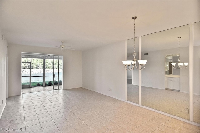 8580 Cedar Hammock Cir Unit 714, Naples, FL 34112 - unfurnished room featuring a chandelier, light tile patterned floors, and ceiling fan