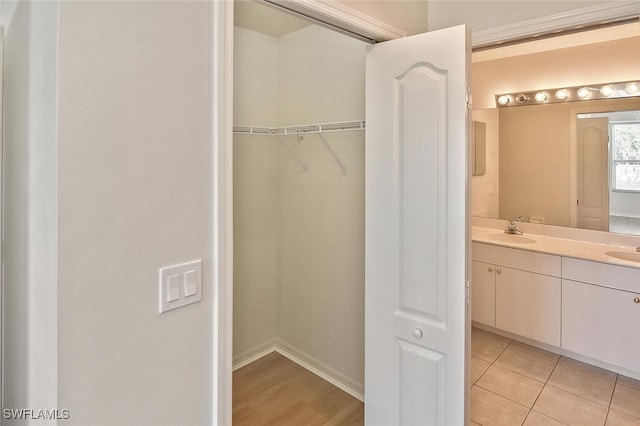 8580 Cedar Hammock Cir Unit 714, Naples, FL 34112 - full bathroom with double vanity and baseboards