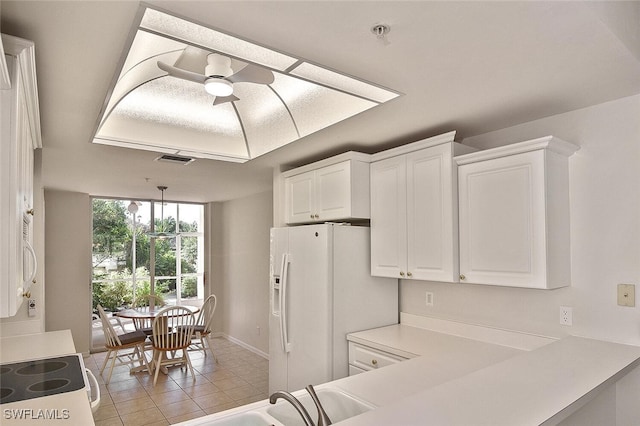 8580 Cedar Hammock Cir Unit 714, Naples, FL 34112 - kitchen with white appliances, white cabinets, light tile patterned floors, a ceiling fan, and light countertops