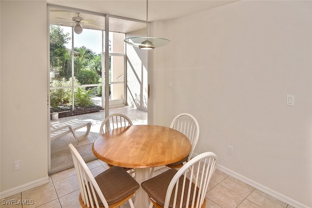 8580 Cedar Hammock Cir Unit 714, Naples, FL 34112 - dining space featuring light tile patterned floors and ceiling fan