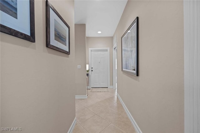 hallway featuring light tile patterned floors