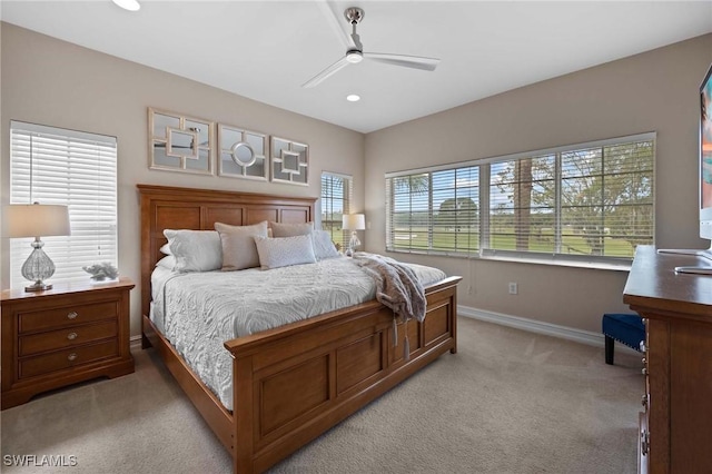 bedroom with ceiling fan and light colored carpet