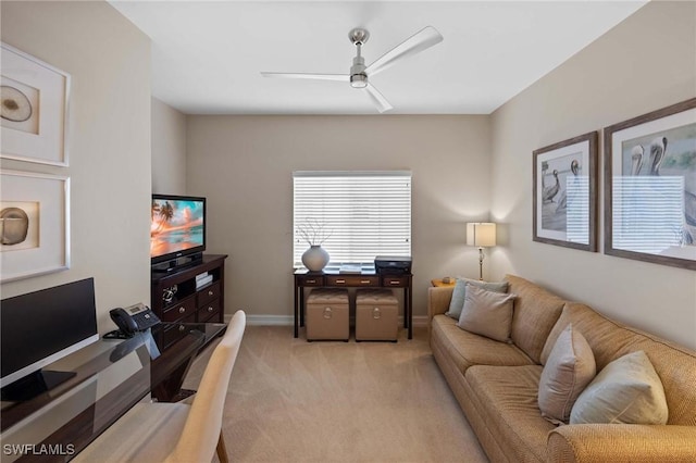 carpeted living room featuring ceiling fan