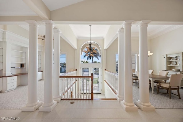 hall featuring ornate columns, ornamental molding, light tile patterned floors, and a notable chandelier