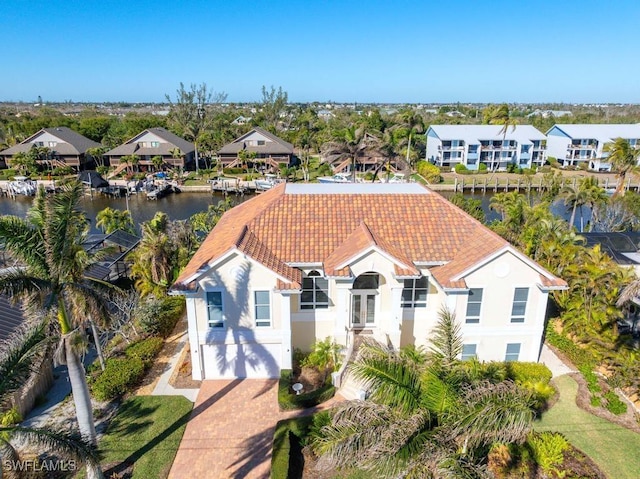 birds eye view of property featuring a water view