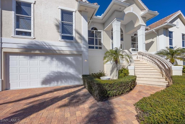 view of front of property with a garage