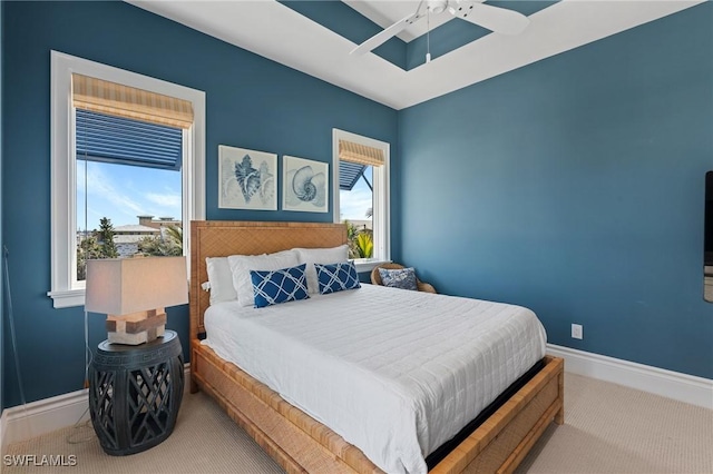 bedroom featuring ceiling fan and light carpet