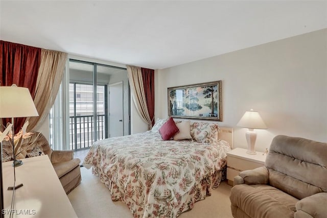 bedroom featuring expansive windows, light colored carpet, and access to exterior