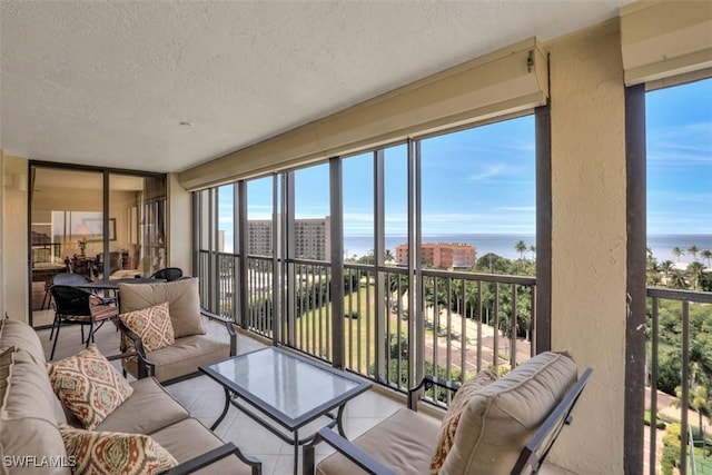 sunroom with a water view