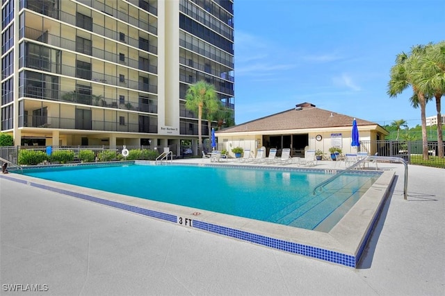 view of swimming pool featuring a patio area