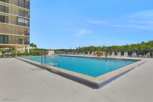 view of swimming pool featuring a patio area