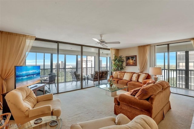 living room with light carpet, floor to ceiling windows, and ceiling fan