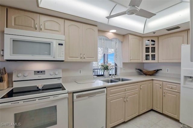 kitchen with ceiling fan, sink, light tile patterned floors, and white appliances