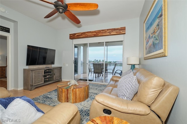 living room with ceiling fan and light tile patterned floors