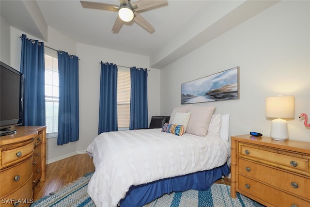 bedroom with ceiling fan and hardwood / wood-style flooring