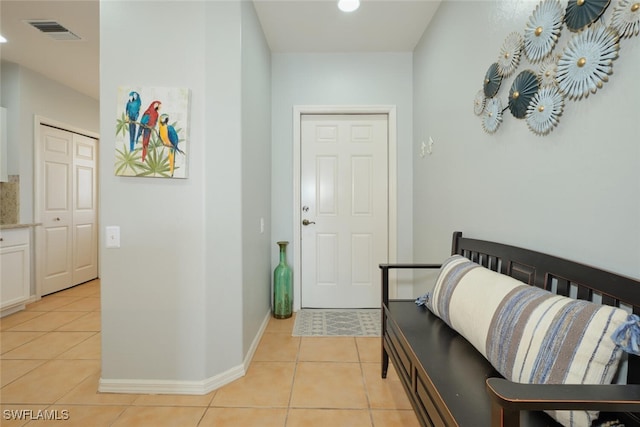 entrance foyer featuring light tile patterned floors