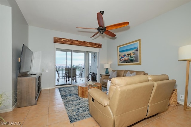 tiled living room featuring ceiling fan