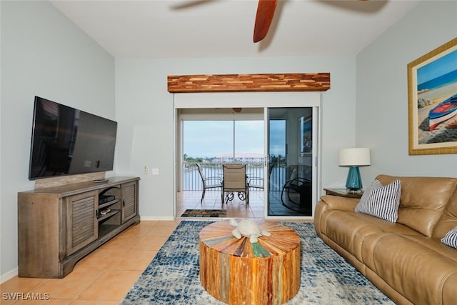 living room with ceiling fan and light tile patterned floors