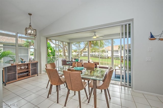 sunroom / solarium featuring lofted ceiling and ceiling fan with notable chandelier