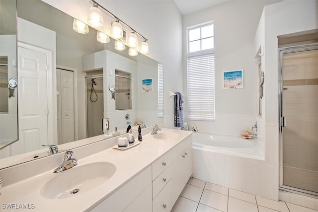 bathroom featuring independent shower and bath, tile patterned floors, and vanity