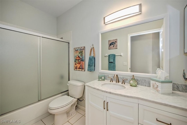 full bathroom featuring toilet, tile patterned floors, vanity, and shower / bath combination with glass door