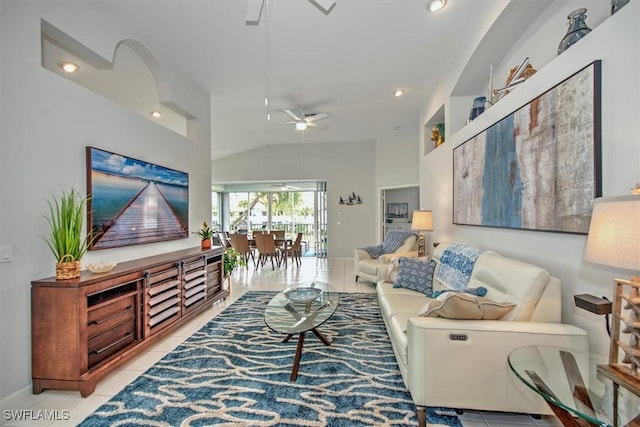 tiled living room with vaulted ceiling and ceiling fan