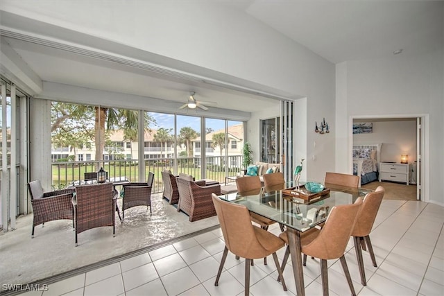 dining room with ceiling fan and light tile patterned flooring