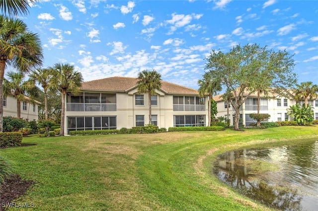 view of building exterior with a water view