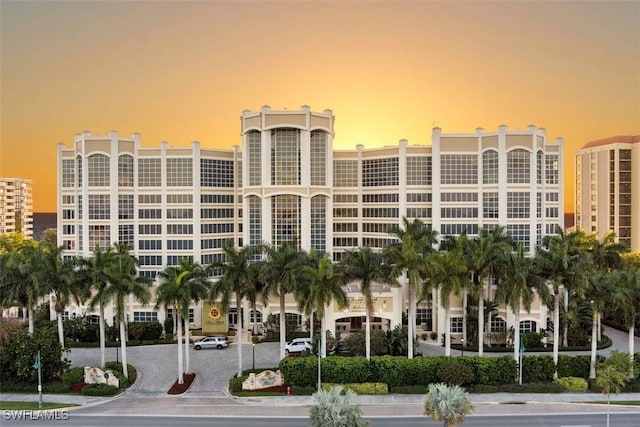 view of outdoor building at dusk