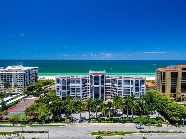 aerial view featuring a water view and a beach view