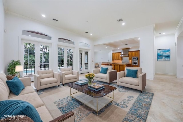 living room featuring french doors and ornamental molding