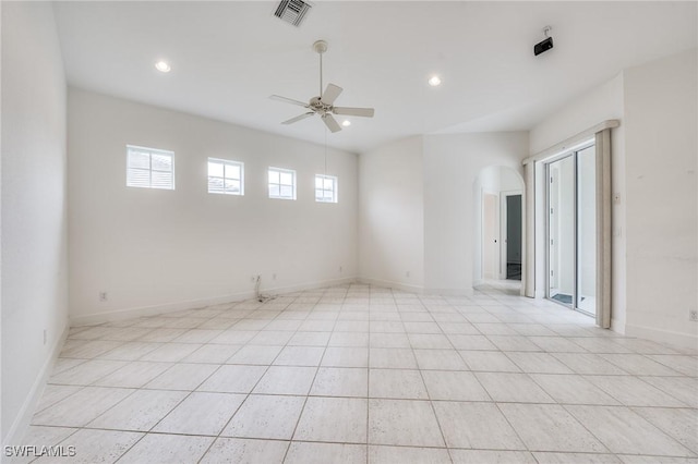 unfurnished room featuring light tile patterned flooring and ceiling fan