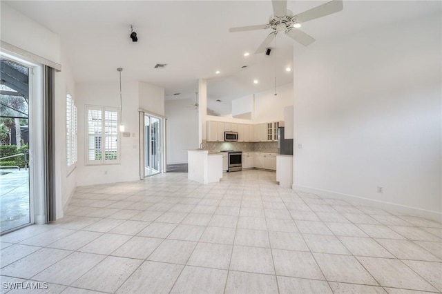 unfurnished living room featuring high vaulted ceiling, light tile patterned floors, and ceiling fan